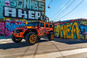 22x12 M25 OffRoad Monster Wheels on the 2021 SEMA Orange Jeep JK