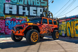 22x12 M25 OffRoad Monster Wheels on the 2021 SEMA Orange Jeep JK