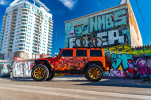 22x12 M25 OffRoad Monster Wheels on the 2021 SEMA Orange Jeep JK