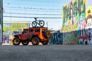 22x12 M25 OffRoad Monster Wheels on the 2021 SEMA Orange Jeep JK